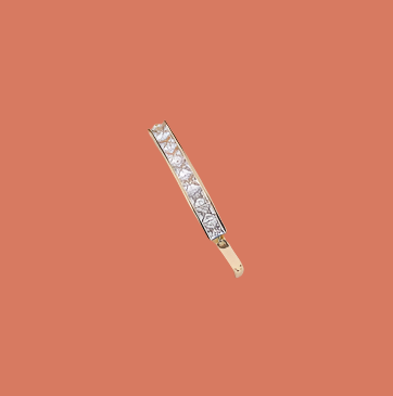 A gold-plated bracelet with zirconia accents.