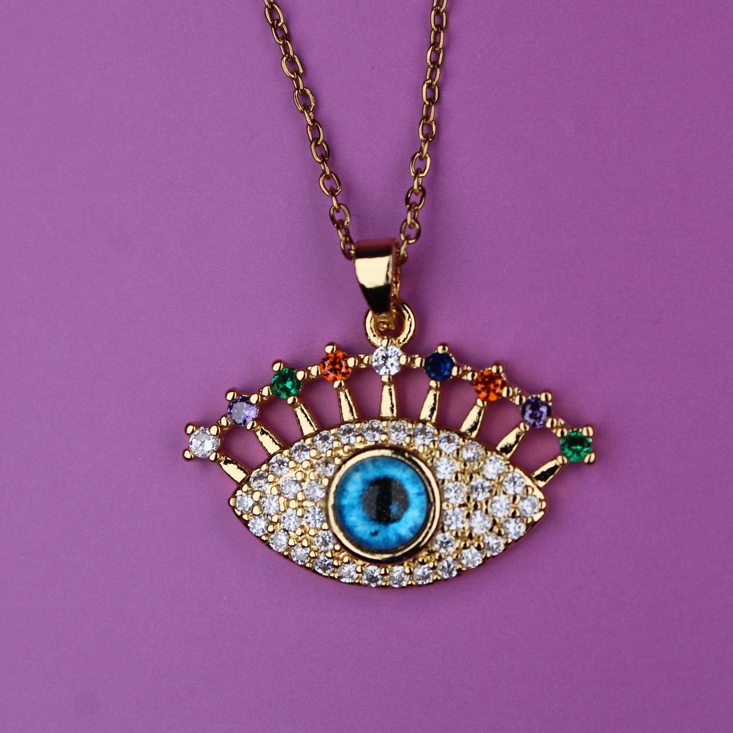 Necklace with an eye-shaped pendant on a purple background