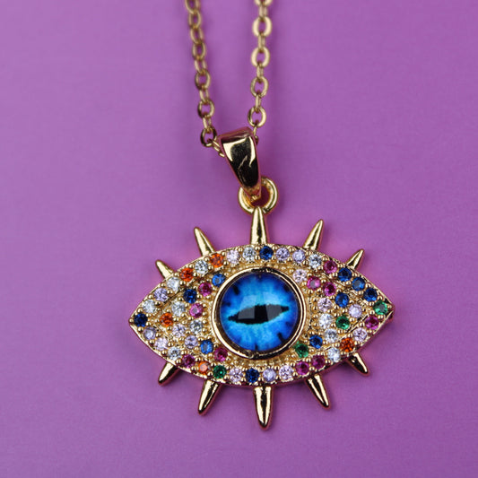 Decorative necklace with an eye-shaped pendant on a purple background