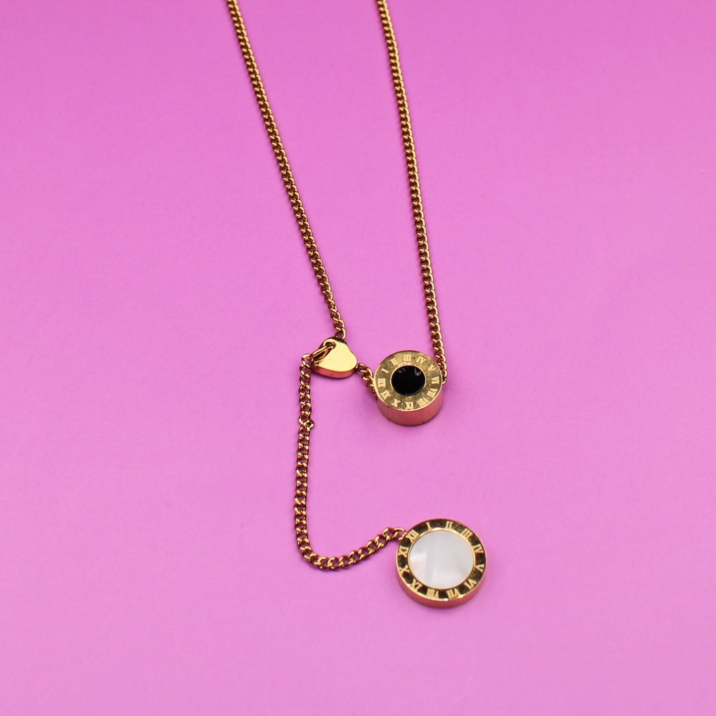 Necklace with pendant on a pink background