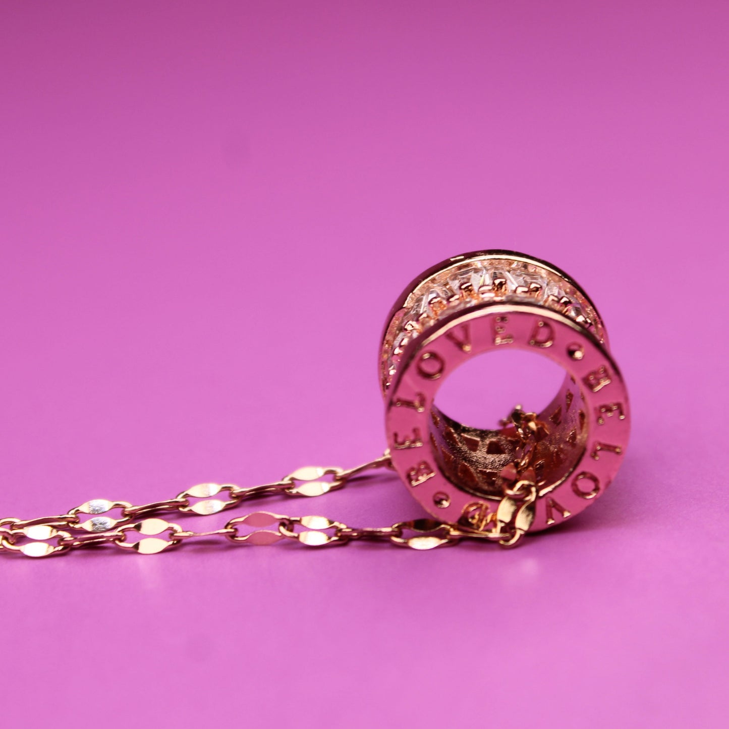 Rose gold hairpin on a pink background
