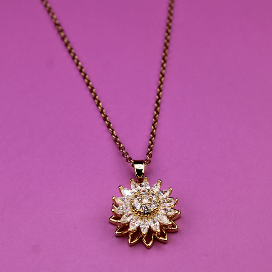 Necklace with a sunflower-shaped pendant on a pink background