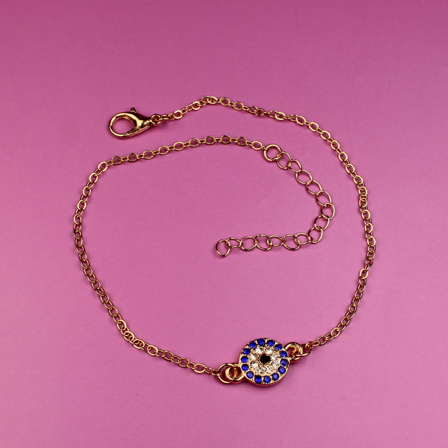 Bracelet with a decorative clasp on a pink background