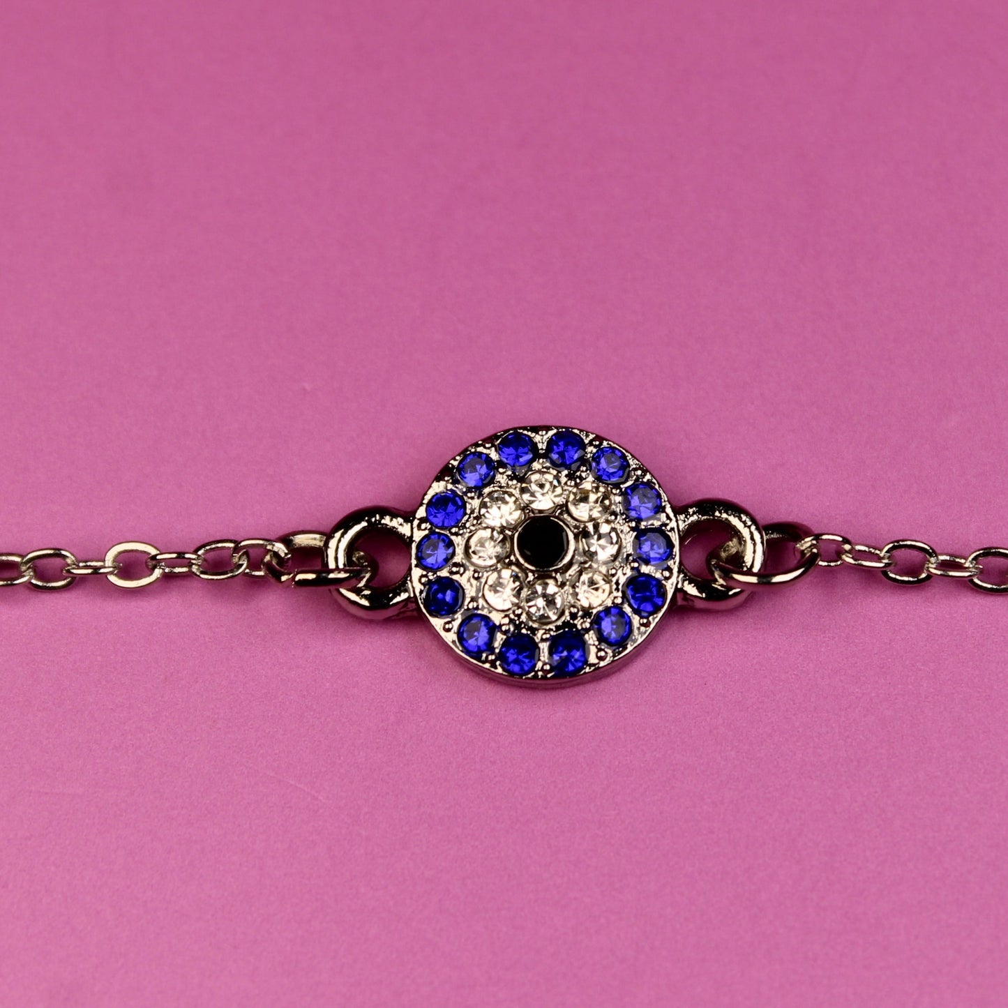 Bracelet with a decorative clasp on a pink background