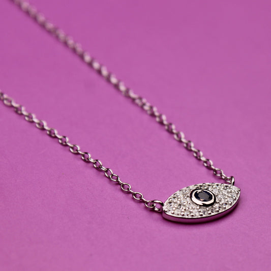 Necklace with a pendant on a pink background