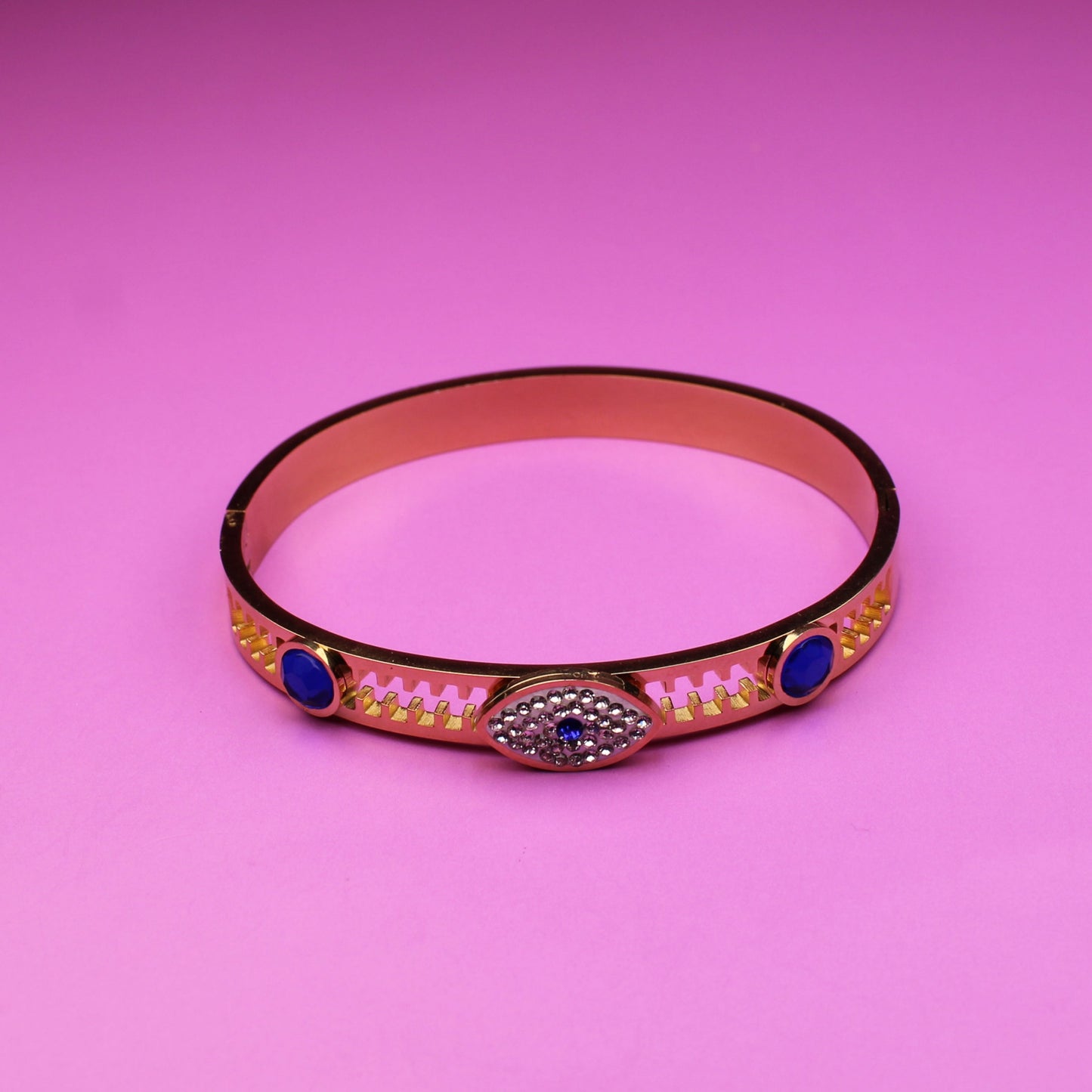 Bracelet with decorative elements on a pink background