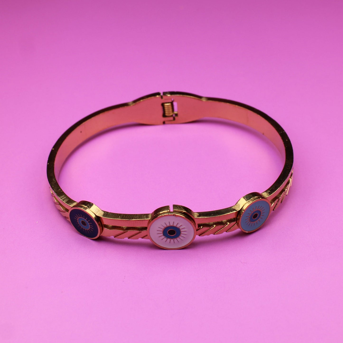 Bracelet with black stones on a pink background
