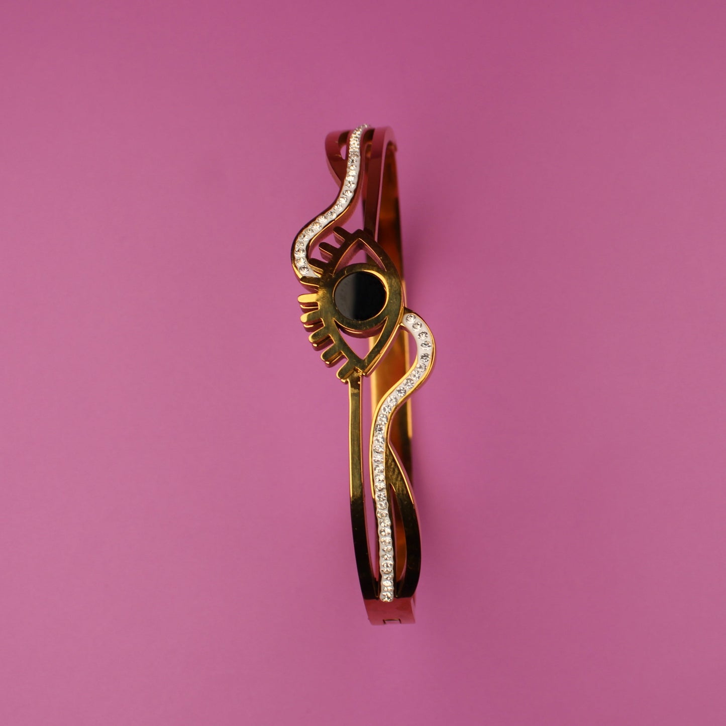 Decorative brooch on a pink background