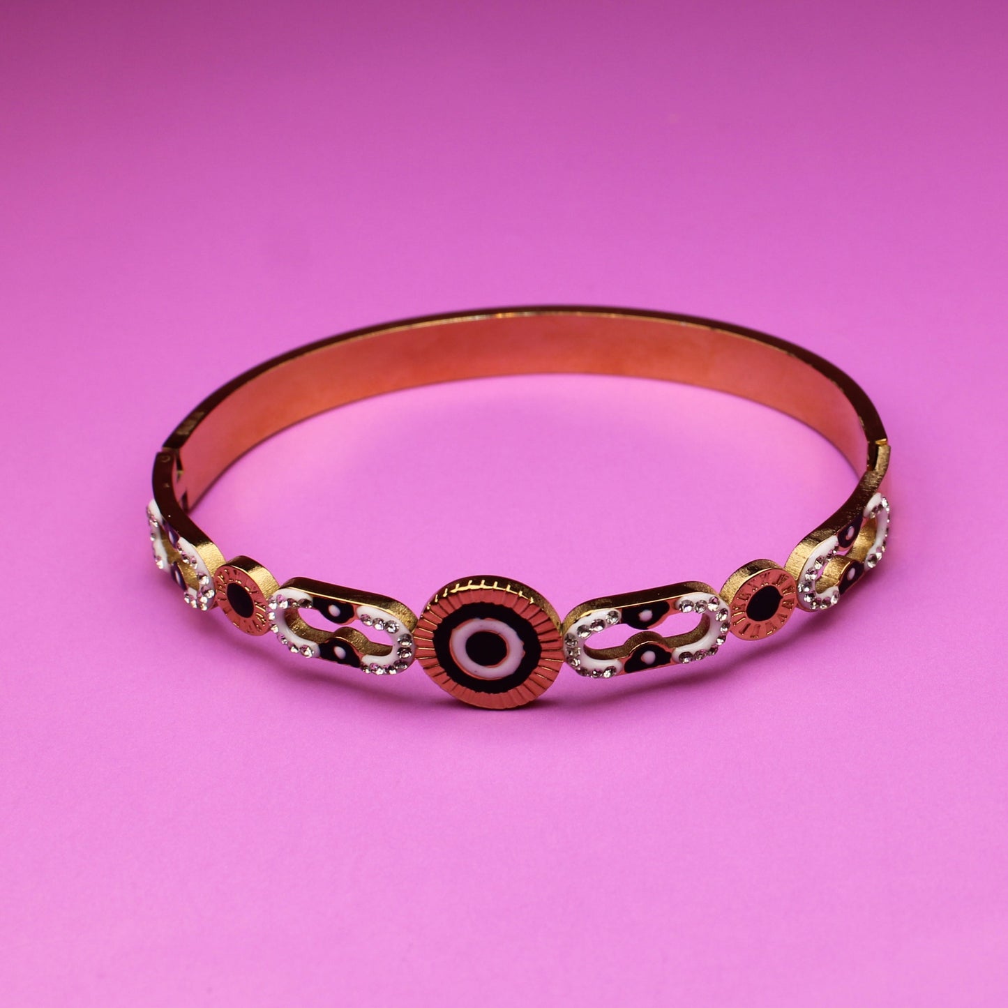 Decorative bracelet on a pink background