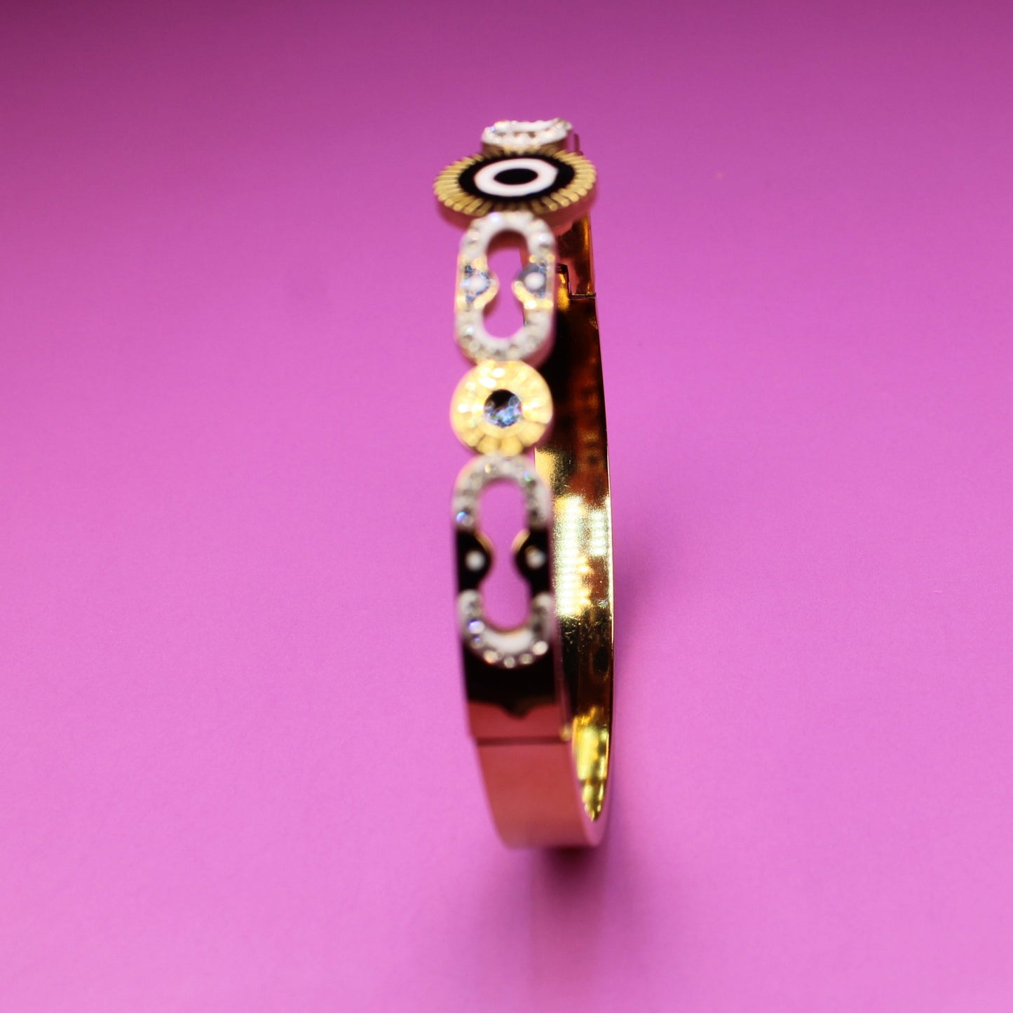 Bracelet with colorful circular patterns on a pink background