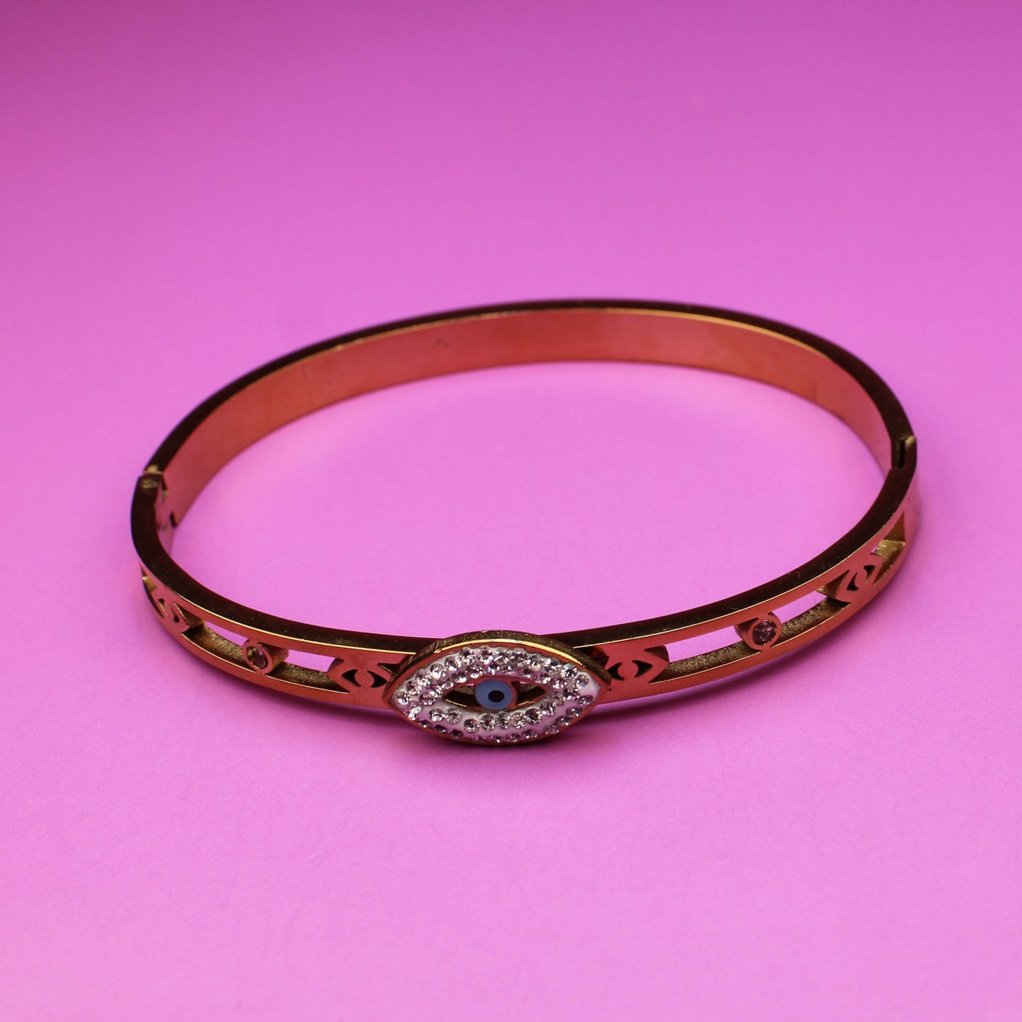 Bracelet with a decorative clasp on a pink background