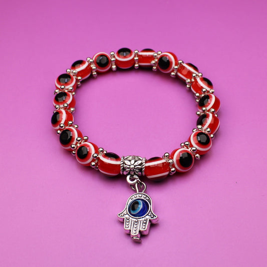 Bracelet with a charm on a pink background