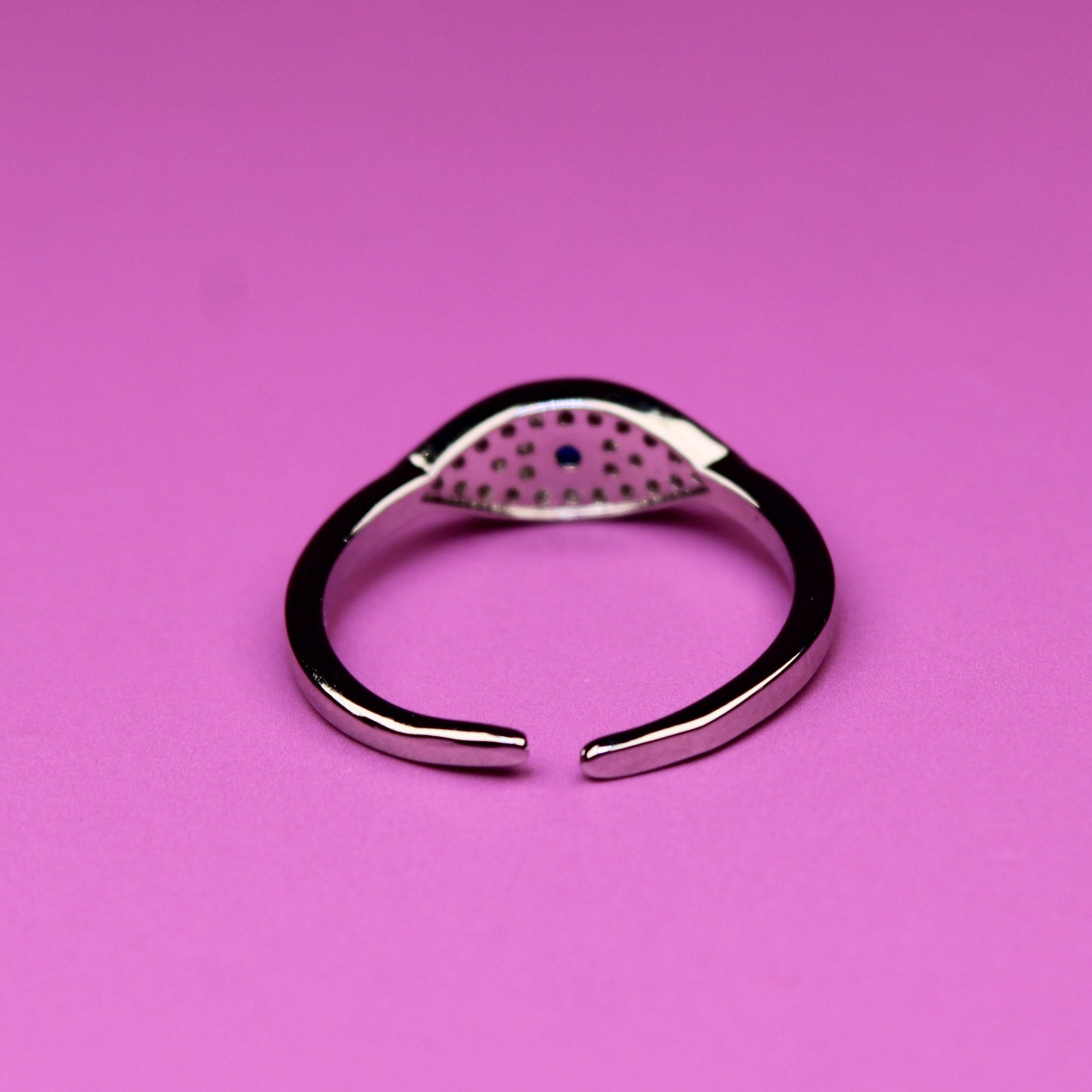 Silver ring on a pink background
