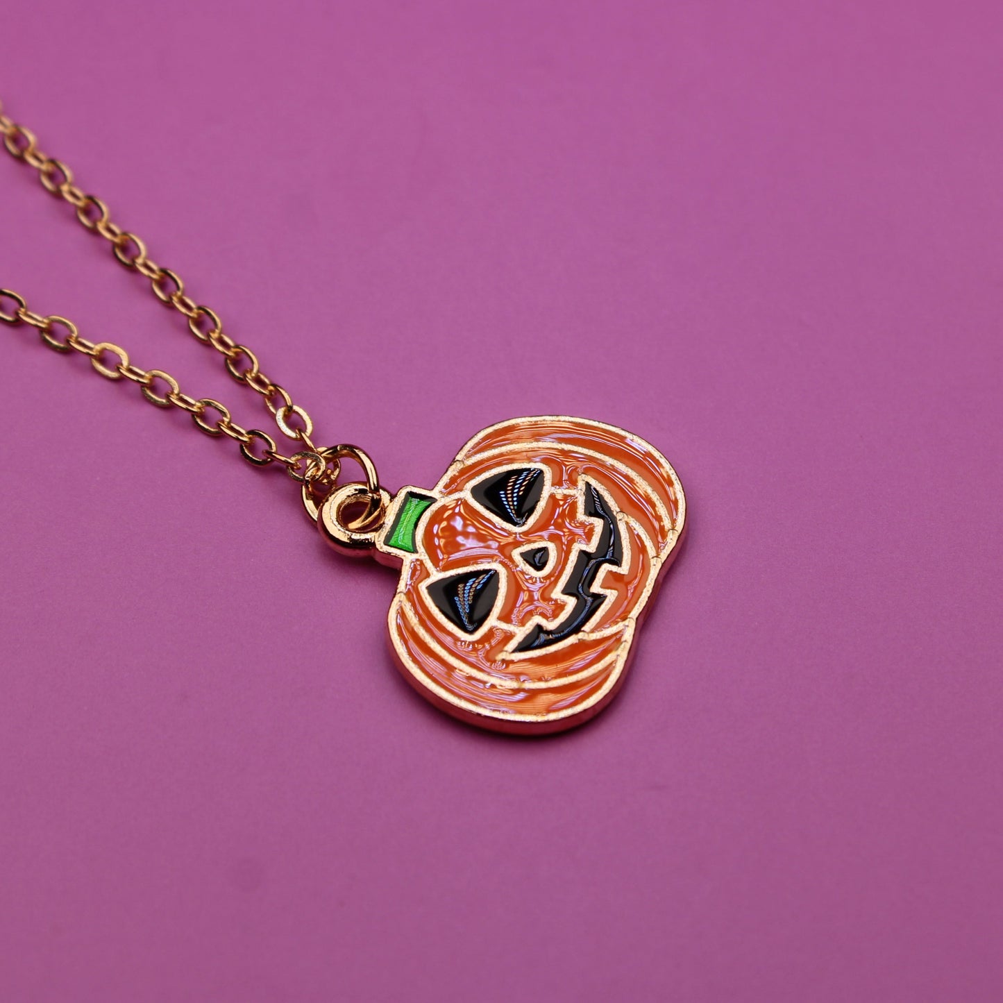 Necklace with a heart-shaped pendant on a purple background