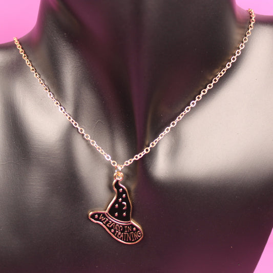 Necklace with a pendant on a mannequin bust against a pink background