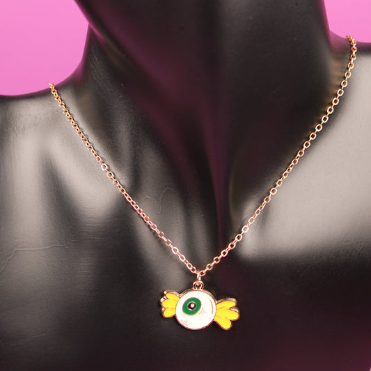 Necklace with a pendant on a black mannequin against a pink background