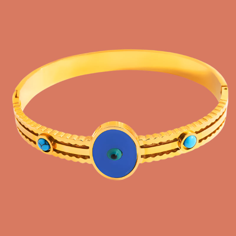 Gold bracelet with a blue centre stone