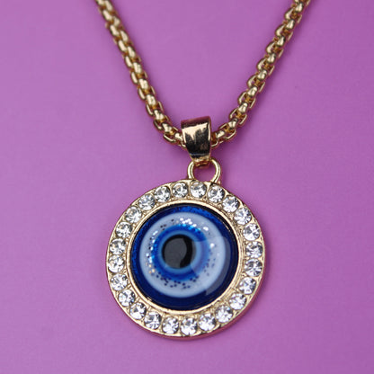 Necklace with a blue eye pendant on a purple background