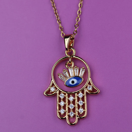 Necklace with Hamsa hand pendant featuring an eye design on a purple background