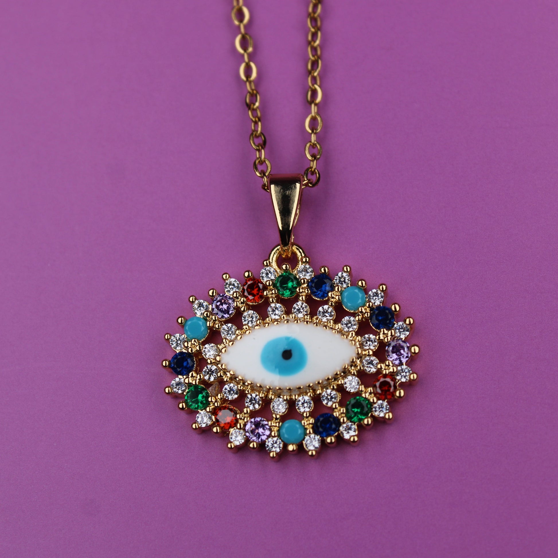 Necklace with an eye-shaped pendant on a purple background