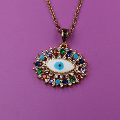 Colorful evil eye pendant necklace on a purple background