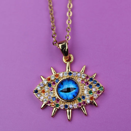 Eve's eye pendant necklace with colorful gemstones on a purple background