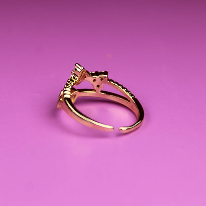 Gold ring on a pink background