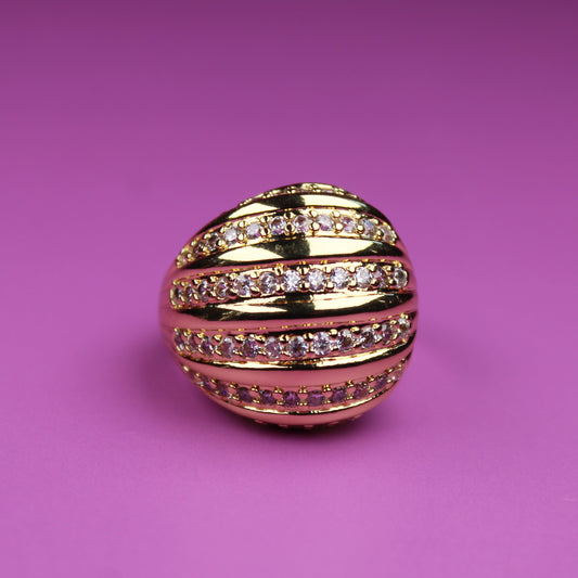 Gold and pink decorative ball on a pink background