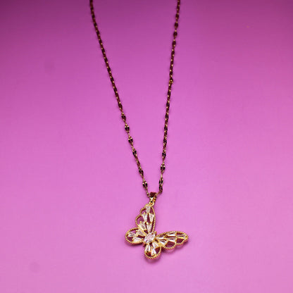Necklace with a butterfly pendant on a pink background