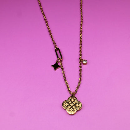 Necklace with a pendant on a pink background
