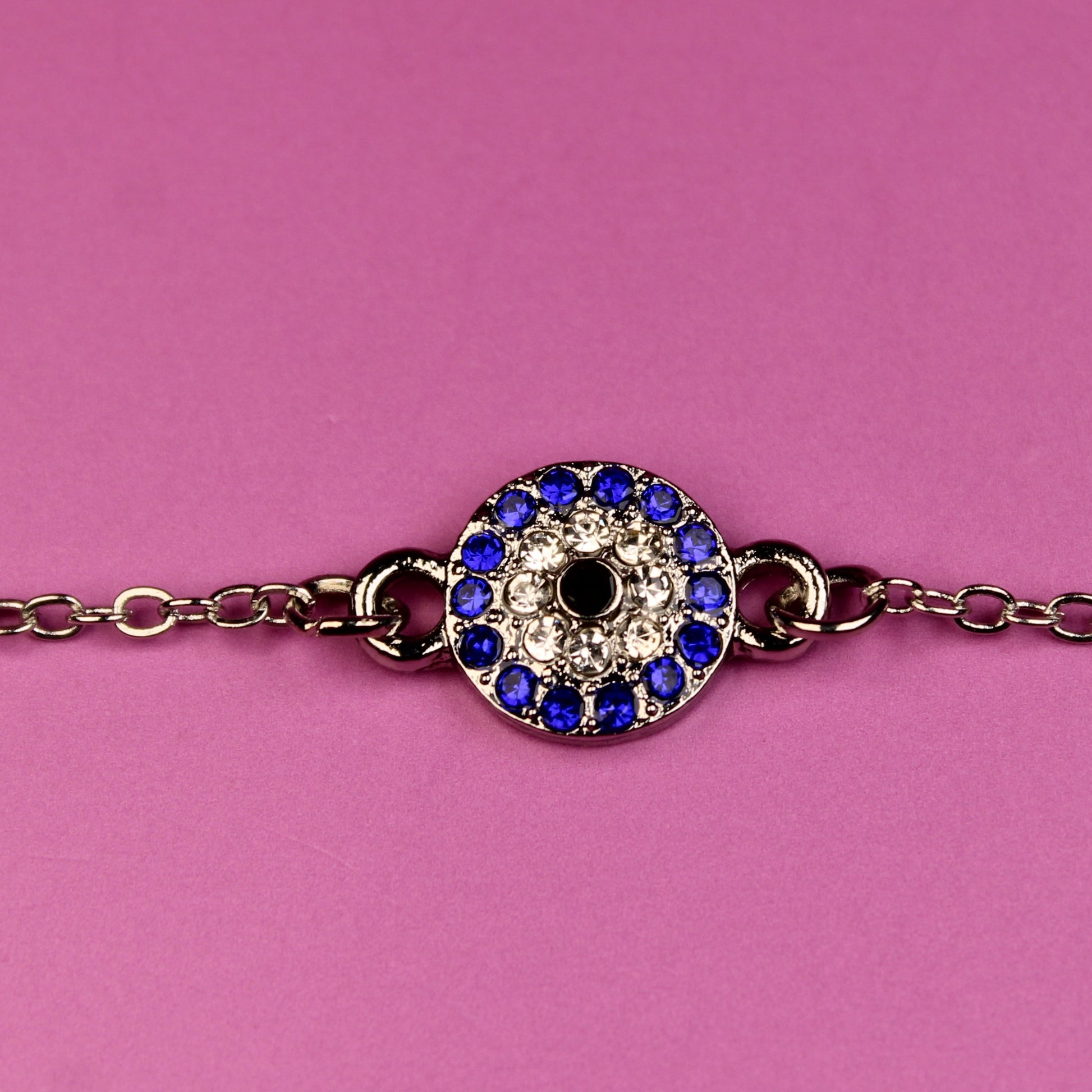 Bracelet with a decorative clasp on a pink background