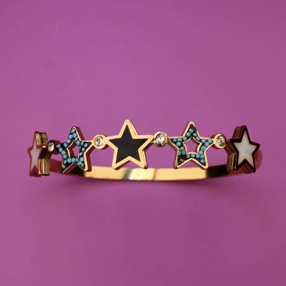 Bracelet with star-shaped charms on a purple background