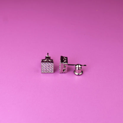 Pair of cufflinks on a pink background