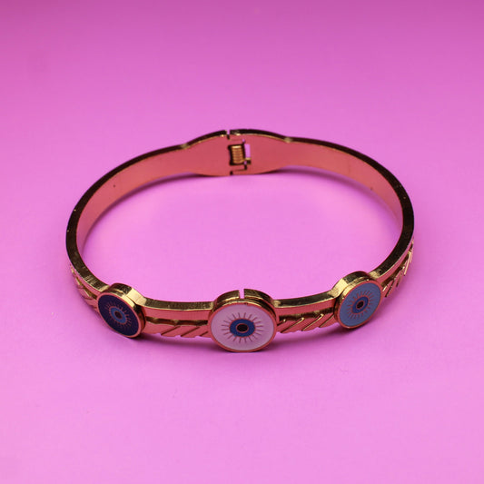 Bracelet with black stones on a pink background