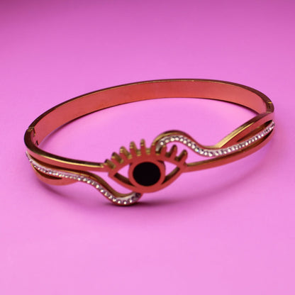 Bracelet with an eye design on a pink background
