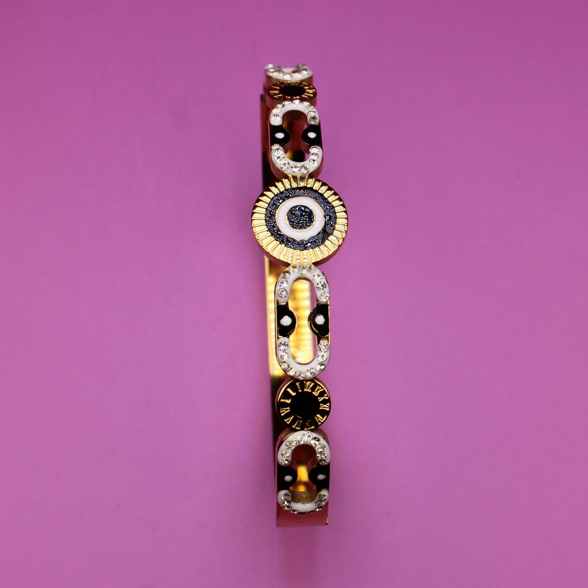 Bracelet with circular design on a pink background