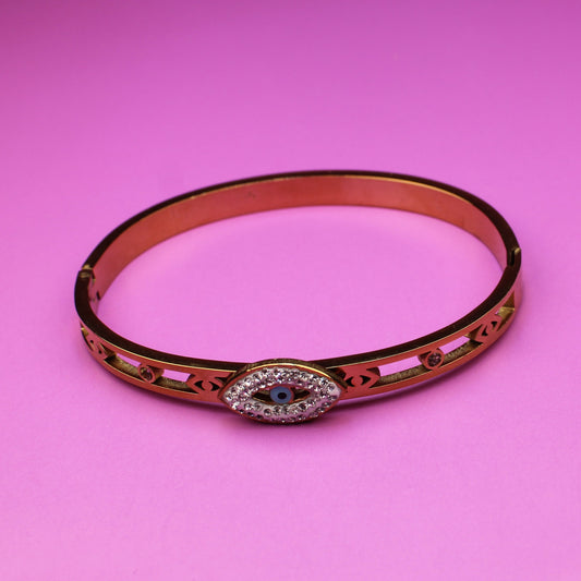 Bracelet with a decorative clasp on a pink background