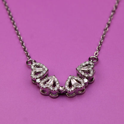 Necklace with diamond-like stones on a pink background