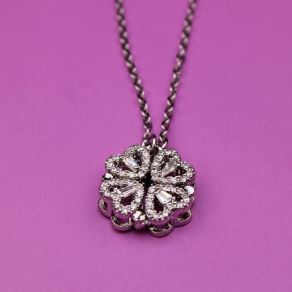 Necklace with a decorative pendant on a pink background