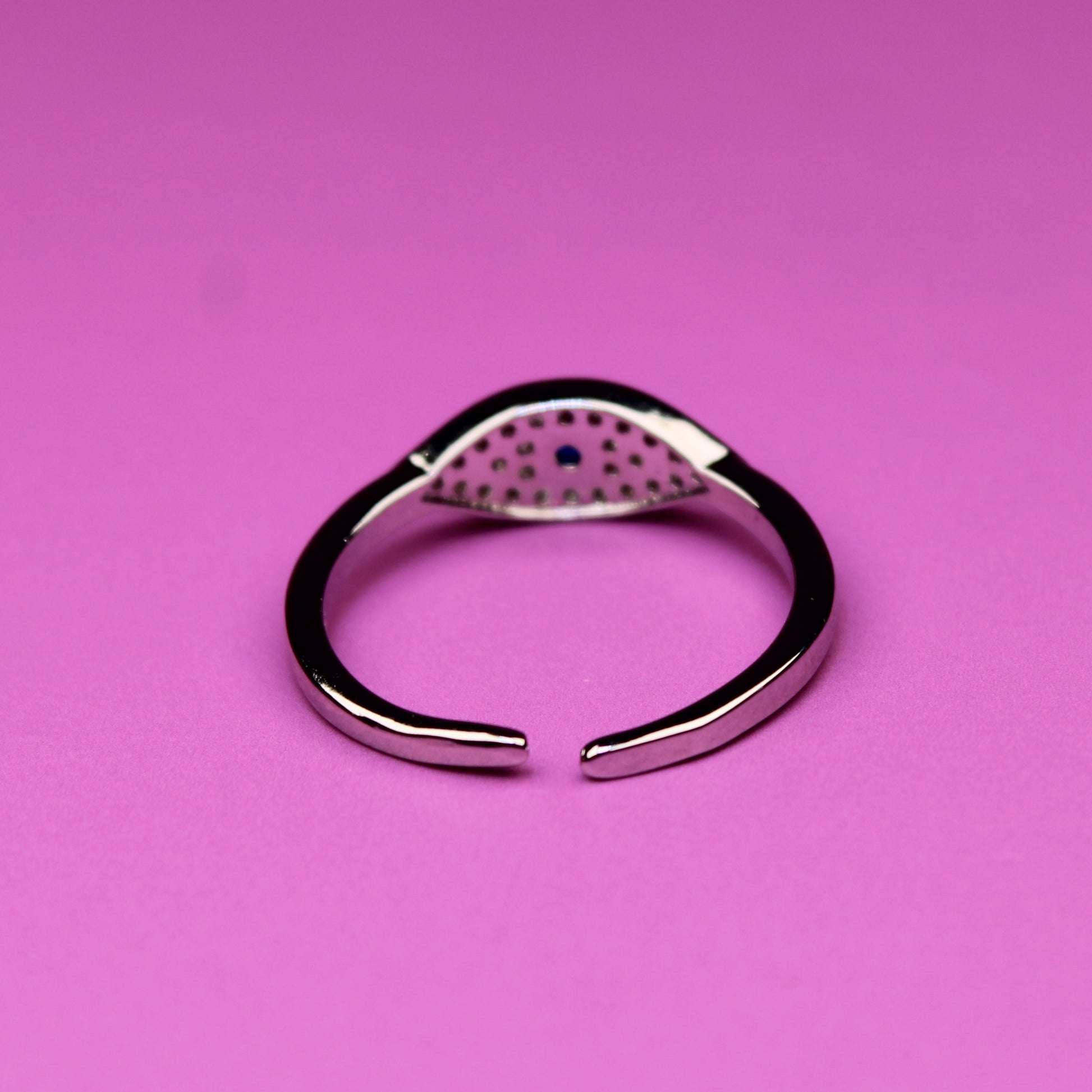 Silver ring on a pink background