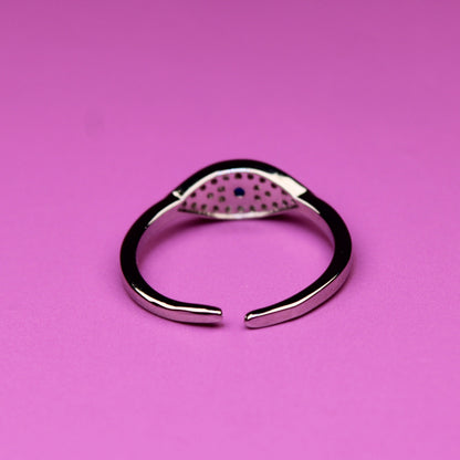 Silver ring on a pink background