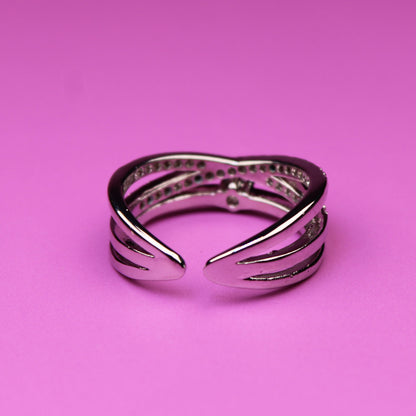 Silver bracelet on a pink background