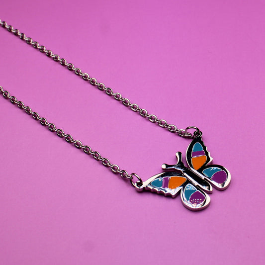 Butterfly necklace on a pink background