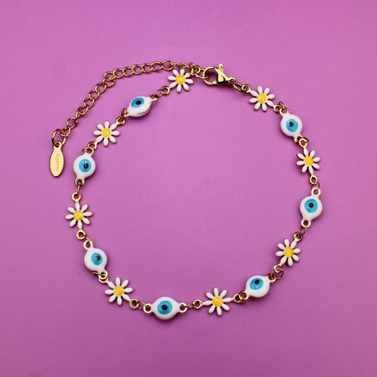 Necklace with floral designs on a pink background
