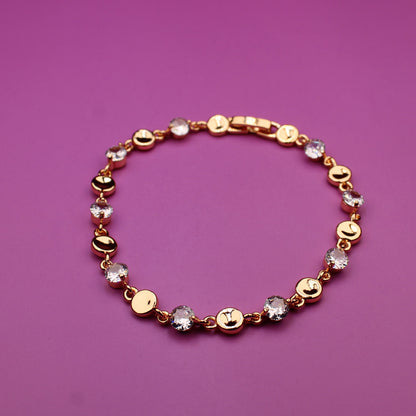 Bracelet with gold and multicolored beads on a purple background
