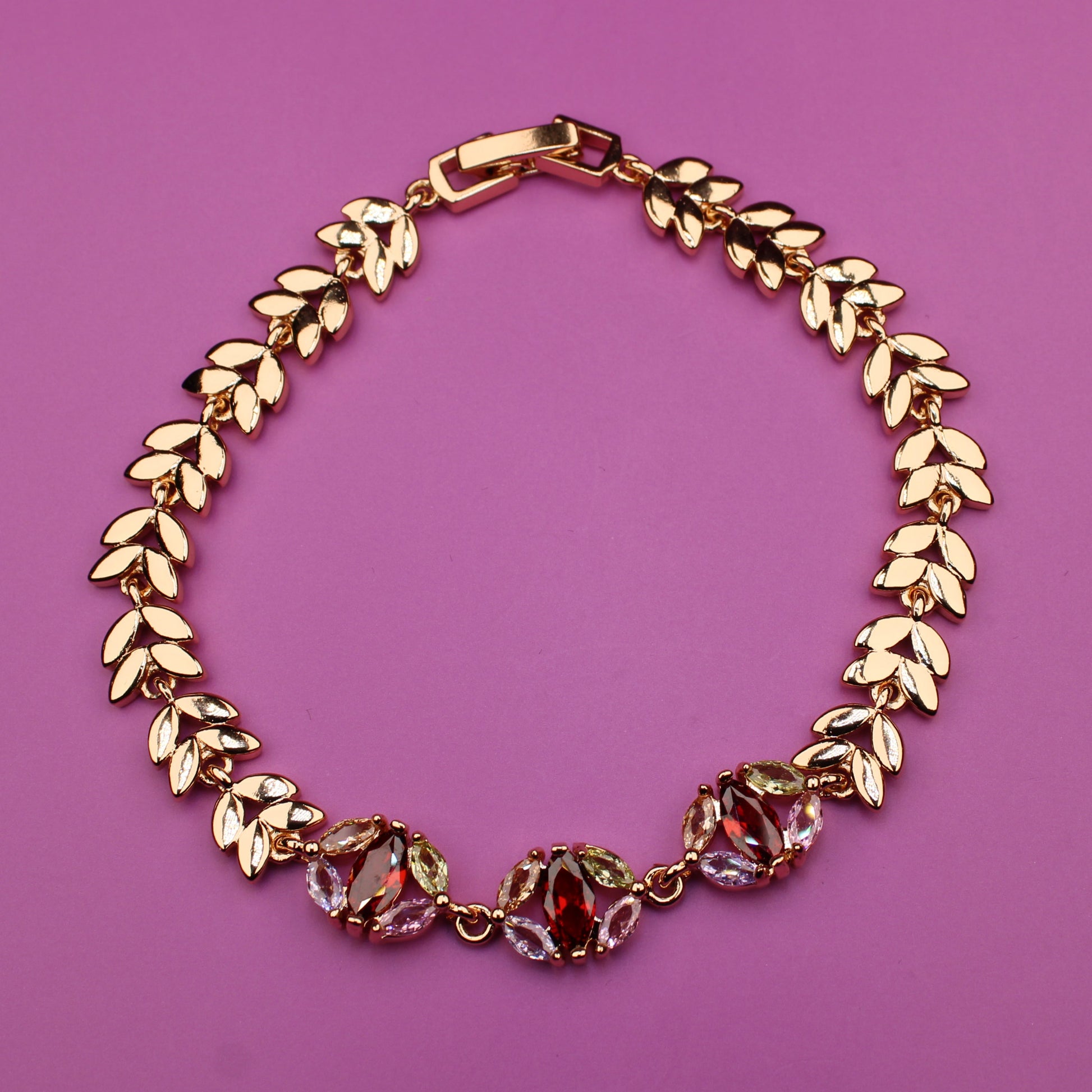 Gold bracelet on a purple background