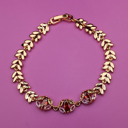 Gold bracelet on a purple background