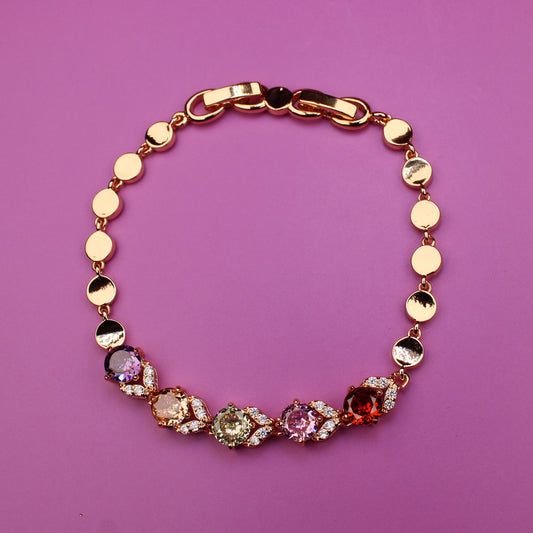 Bracelet with colorful beads on a pink background