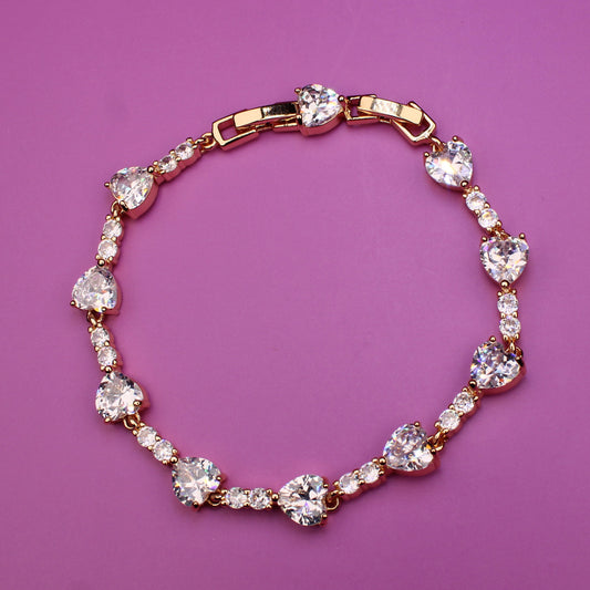 Bracelet with heart-shaped crystals on a purple background