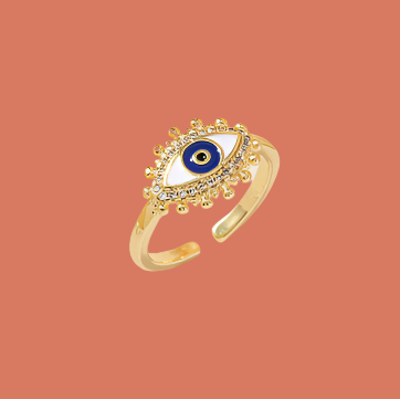 Gold bracelet with a blue eye design on a white surface